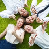 Top down shot of group of young business people having fun in an informal atmosphere.